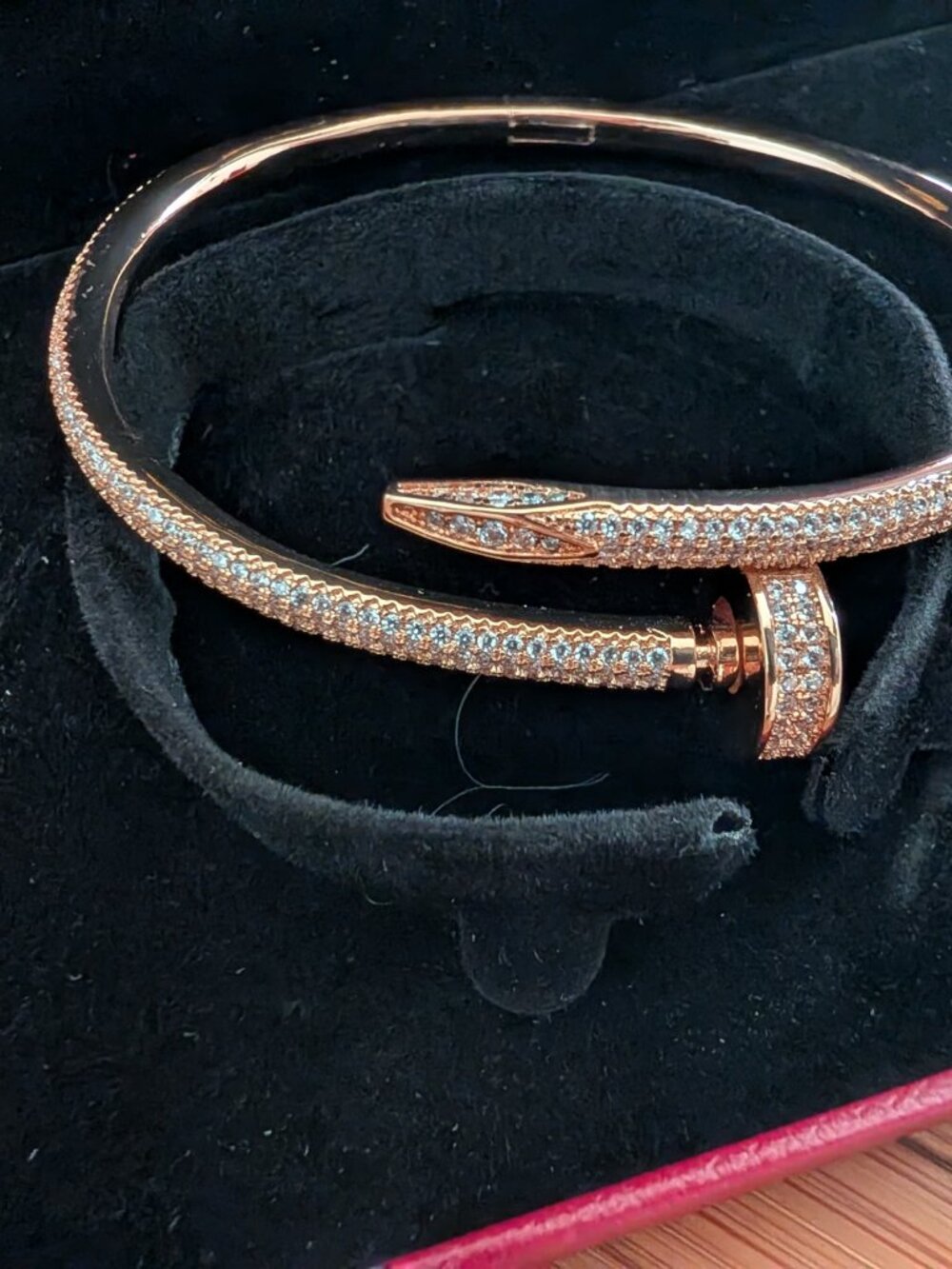 Beautiful "Cartier" rose gold-tone nail-inspired bangle paved w sparkling stones